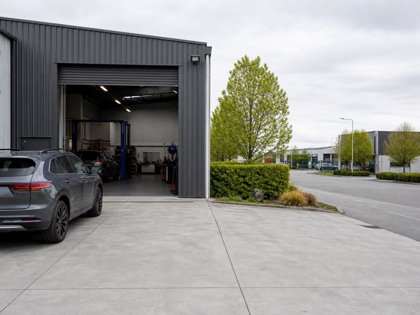 Generated placeholder image of a tidy industrial auto workshop exterior.